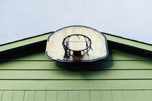 Basketball Hoop Attached To Exterior Of Residential Garage