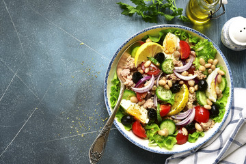 Wall Mural - Tuna salad with vegetables and white bean.Top view with copy space.