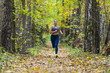 © dima - Woman running in the autumn park