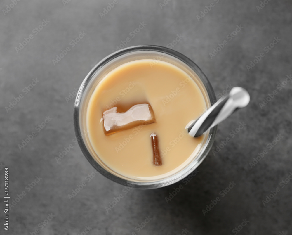 Glass with protein shake on table