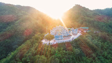 Wat Pa Phu Kon In Ubon Ratchathani,Thailand.Is A Public Temple. In The Middle Of The Forest Is Beautiful. And Is Popular With Tourists.The Morning Sun Shines From The Hills.