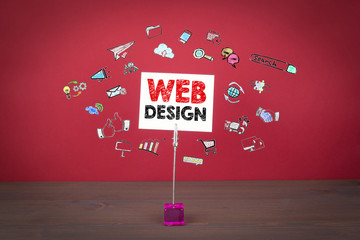 Wall Mural - web design concept. wooden table at the red background.