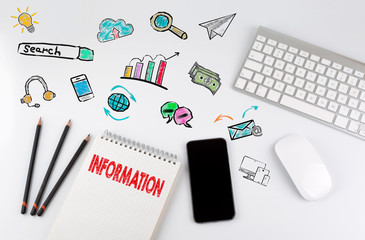 Wall Mural - information concept. office desk table with computer, smartphone and note pad.