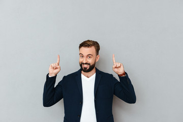 Sticker - Happy bearded man in business clothes pointing up