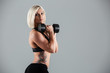 © Drobot Dean - Portrait of a serious muscular adult sportswoman