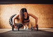 © pyrozenko13 - Woman works out her shoulders on the floor in gym