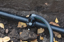 Sprinkler System Pipe In Dirt Trenches For Underground Irrigation System Using Water.