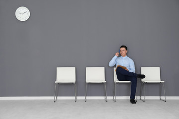 Sticker - Young man waiting for job interview in hall