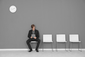 Sticker - Young man waiting for job interview in hall