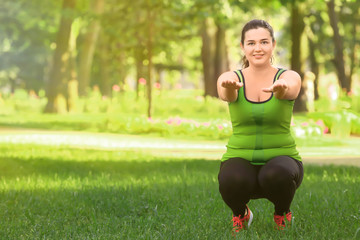 Wall Mural - Overweight young woman exercising in park. Weight loss concept