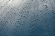 © Paul Edmondson/Stocksy - Raindrops on hood of car, close up