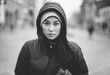 © Alexey Kuzma/Stocksy - real young asian woman on the street