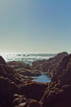 Coastal Rocks And A Tidepool