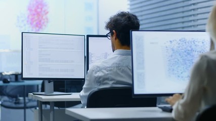 Fototapete - Team of Talented Computer Engineers Programming at Their Workstations. Independent Company Works on a Neural Network Machine Learning Development Project