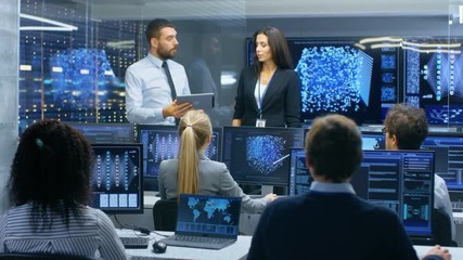 Leinwandbilder - Head of the Department and Project Manager Discuss Work Process Using Data on a Tablet Computer.Multi-Ethnic Team of Engineers Working at their Workstation.