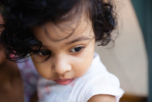 Close Up Portrait Of Toddler In Sad Mood