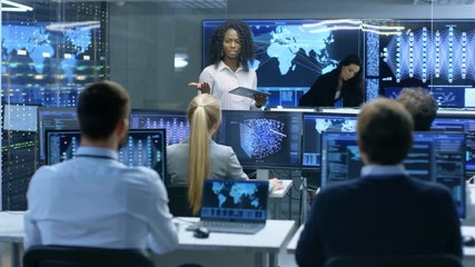 Aufkleber - Chief Project Engineer Consults Tablet Computer and Holds Briefing for a Team of Scientists that are Building Machine Learning System. Displays Show Working Model of Neural Network. 