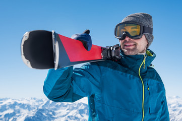 Wall Mural - Man holding ski