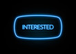 © zobaair - Interested  - colorful Neon Sign on brickwall