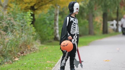 Canvas Print - Cute child, boy in the park with Halloween costumes, having fun