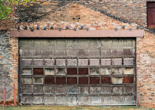 Closed Enteryway To An Abandoned Brick Warehouse