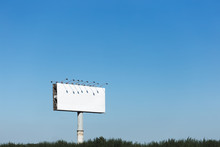 White Billboard Against The Blue Sky