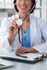 Wall Mural - Doctor with a stethoscope in the hands, close up. Physician ready to examine and help patient. Medicine, healthcare and help concept