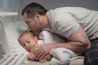 © LIGHTFIELD STUDIOS - father and daughter at bedtime
