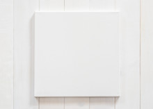 White Canvas Frame Mock Up Template Square Size On White Wood Wall For Arts Painting And Photo Hanging Interior Decoration