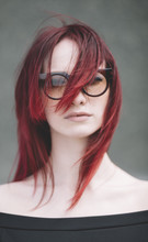 Woman With Red Hair And Sunglasses.