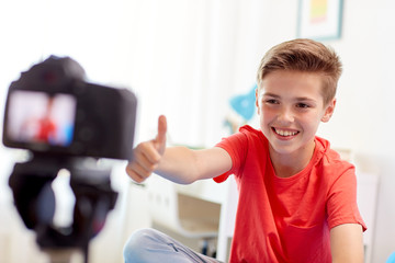 Poster - happy boy with camera recording video at home