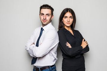 Man and woman standing back to back on gray background