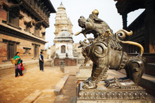 Metal Statue Of Lion Guarding Temple In Bhaktapur Durbar Square.