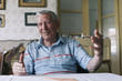 © Jovana Milanko/Stocksy - Elderly man sitting at the table