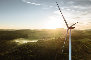 wind turbine in the sunset seen from an aerial view