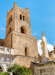 Wall Mural - The Cathedral of Monreale tower with statue of Madonna on the front, Sicily, Italy