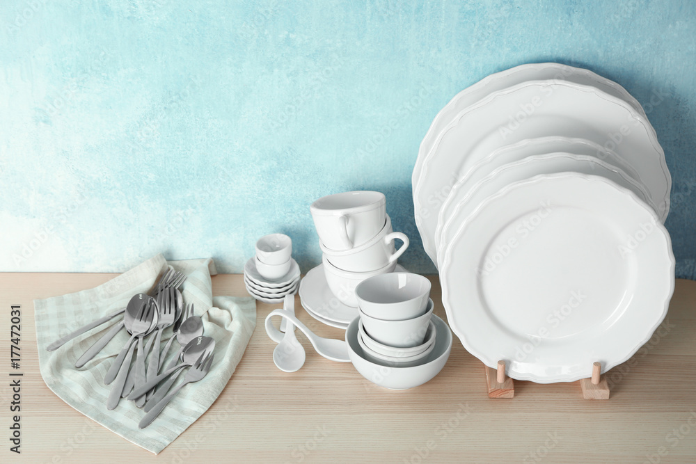 Set of tableware on wooden table