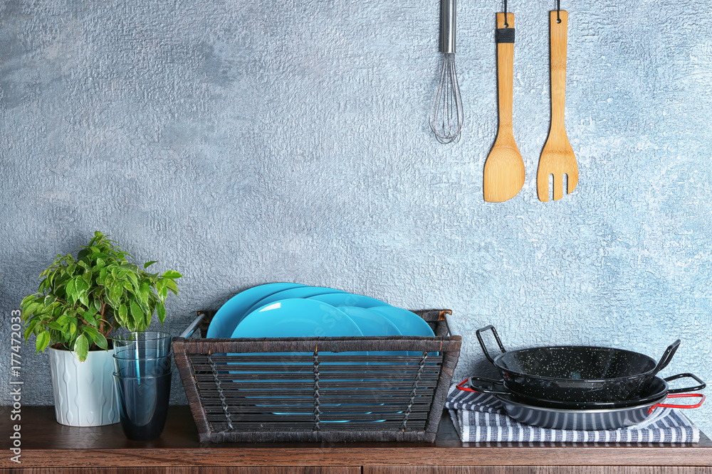 Different kitchenware on wooden table