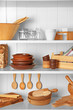 Different kitchenware on shelves