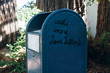 © Carolyn Lagattuta/Stocksy - Large blue mailbox that says Write more Love Letters on the side