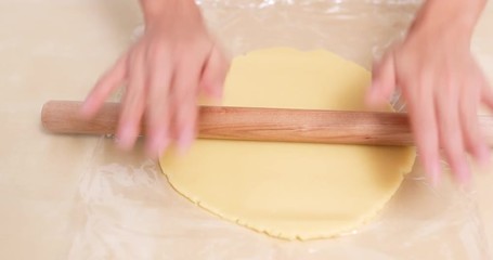 Poster - Chef rolling dough with rolling pin