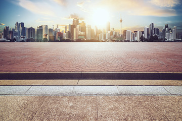 Wall Mural - cityscape with empty brick floor ,sunset sunrise scene .