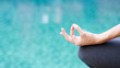 Gyan mudra hand yoga calm peace blue water background