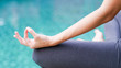 Gyan mudra hand yoga calm peace blue water background