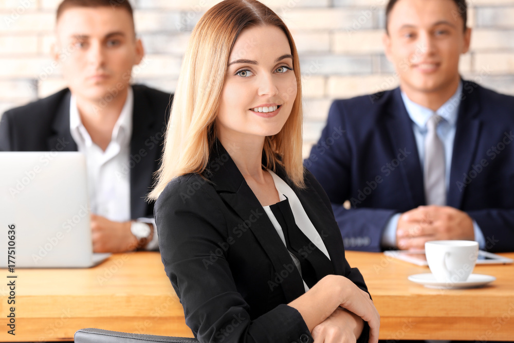 Human resources commission interviewing woman at table