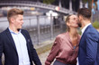 woman kissing man while another is upset