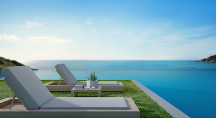 Sea view swimming pool beside terrace and beds in modern luxury beach house with blue sky background, Lounge chairs on green grass at vacation home or hotel - 3d illustration of tourist resort