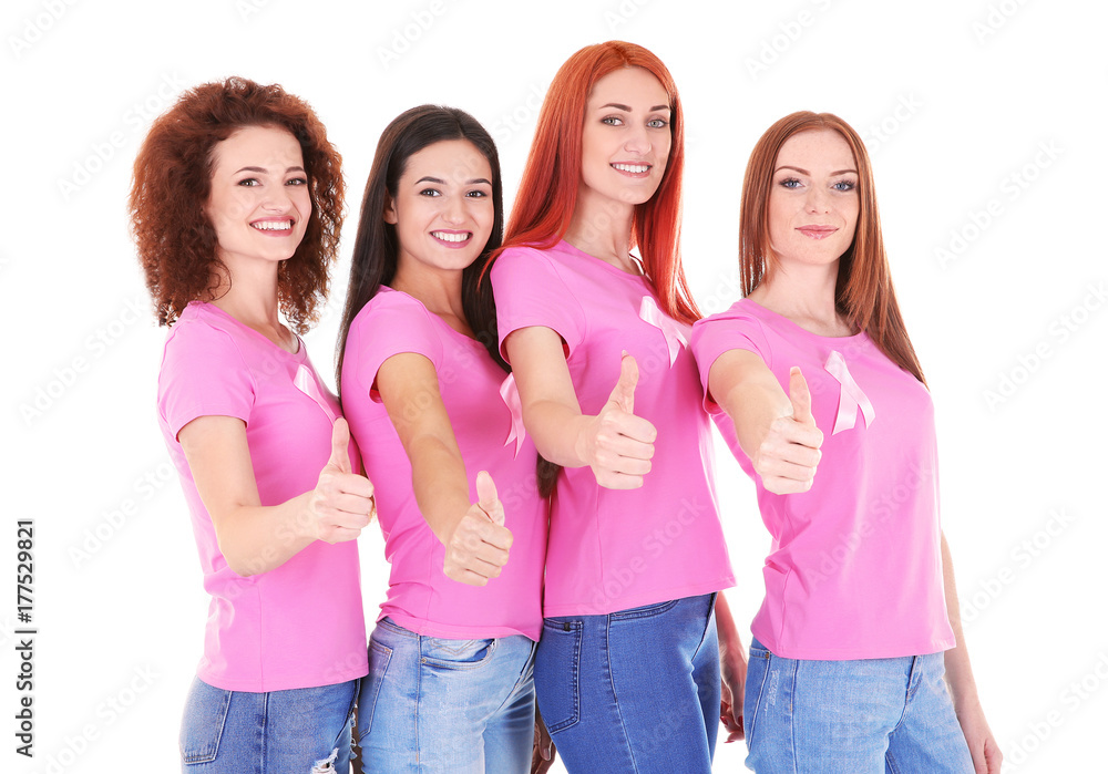 Young women in pink t-shirts on white background. Breast cancer awareness concept