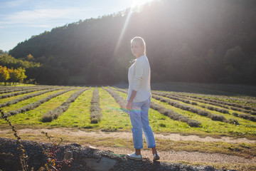 young blond girl in ri italy on the background of the agrarian