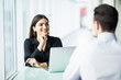 © F8  \ Suport Ukraine - Coworkers talking in the office. Business partners in the office, focus on woman.